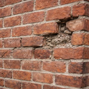 Close-up of damaged brick and mortar on a Toronto home