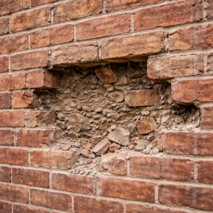 Close-up of damaged bricks on a Toronto wall ready for replacement