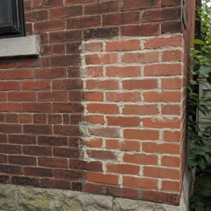 Mismatched brick repair beside original Toronto brickwork.