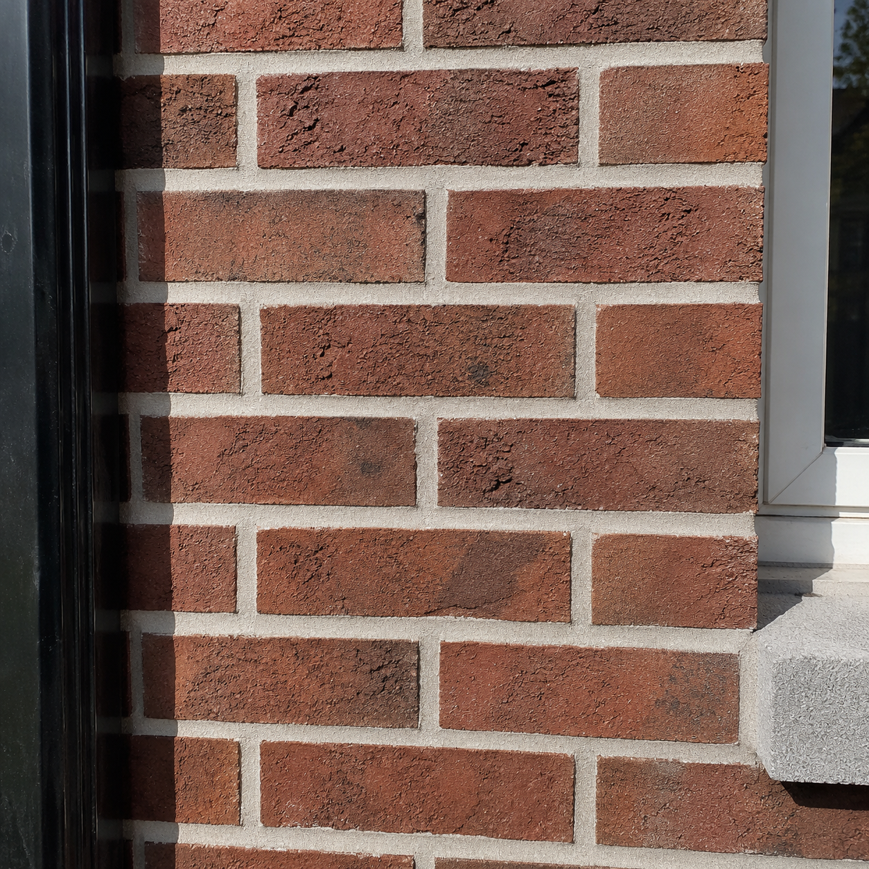 Clean finished mortar joints after tuckpointing on a Toronto brick wall